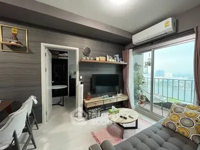 Modern living room with balcony view, stylish decor, and air conditioning