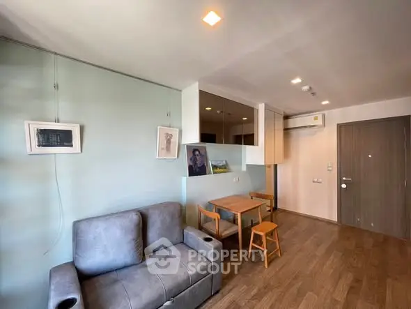 Modern living room with cozy sofa and dining area in stylish apartment