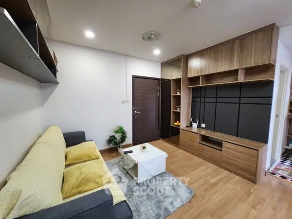 Modern living room with sleek wooden furniture and cozy sofa
