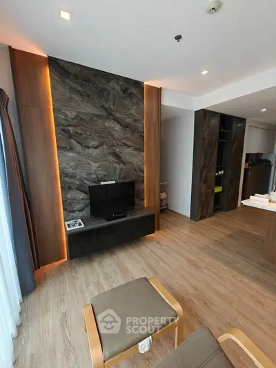 Modern living room with stylish wood paneling and TV setup