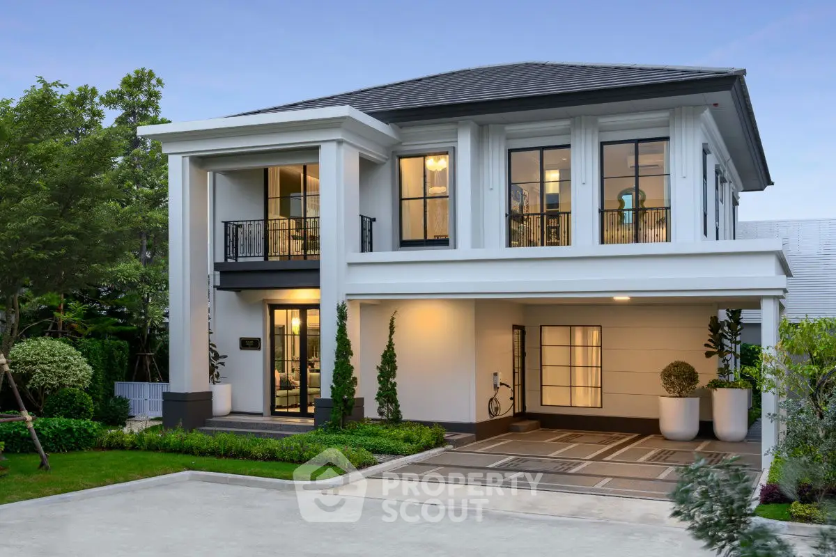 Elegant two-story modern house with landscaped garden and spacious driveway