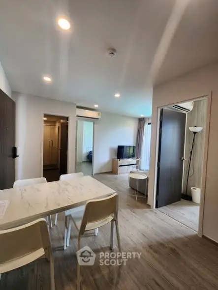 Modern open-plan living room with dining area and stylish decor