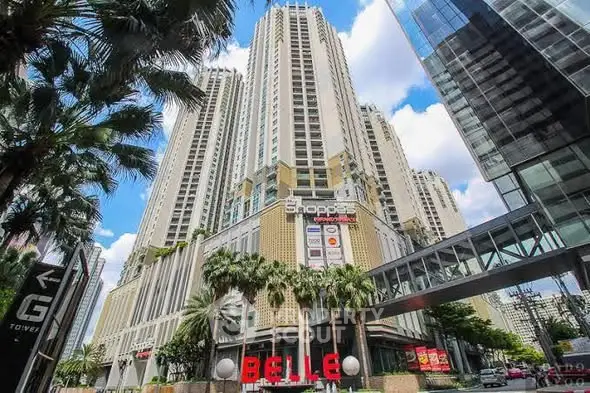 Stunning high-rise building with modern architecture and lush palm trees, perfect for urban living.