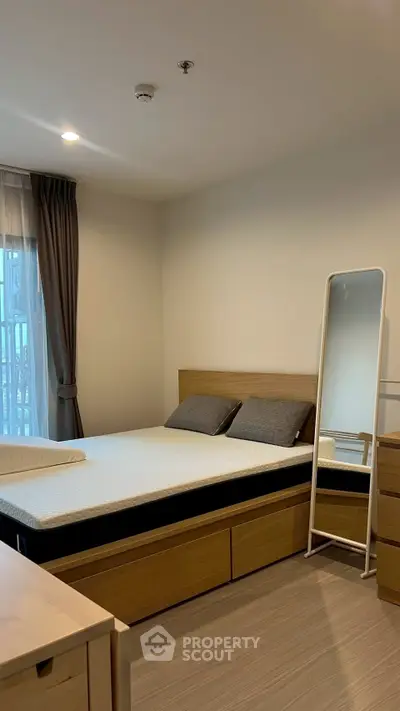 Modern bedroom with wooden furniture and natural light