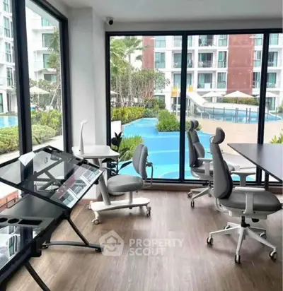 Modern office space with pool view in luxury apartment complex