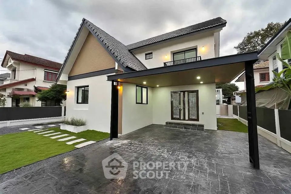 Modern two-story house with spacious driveway and contemporary design
