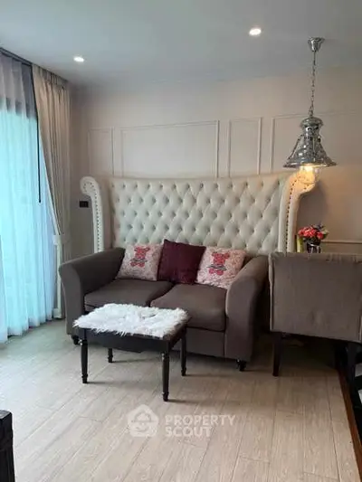 Chic living room with plush sofa and elegant lighting