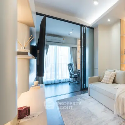 Modern living room with sleek design and natural light, featuring a cozy sofa and stylish decor.