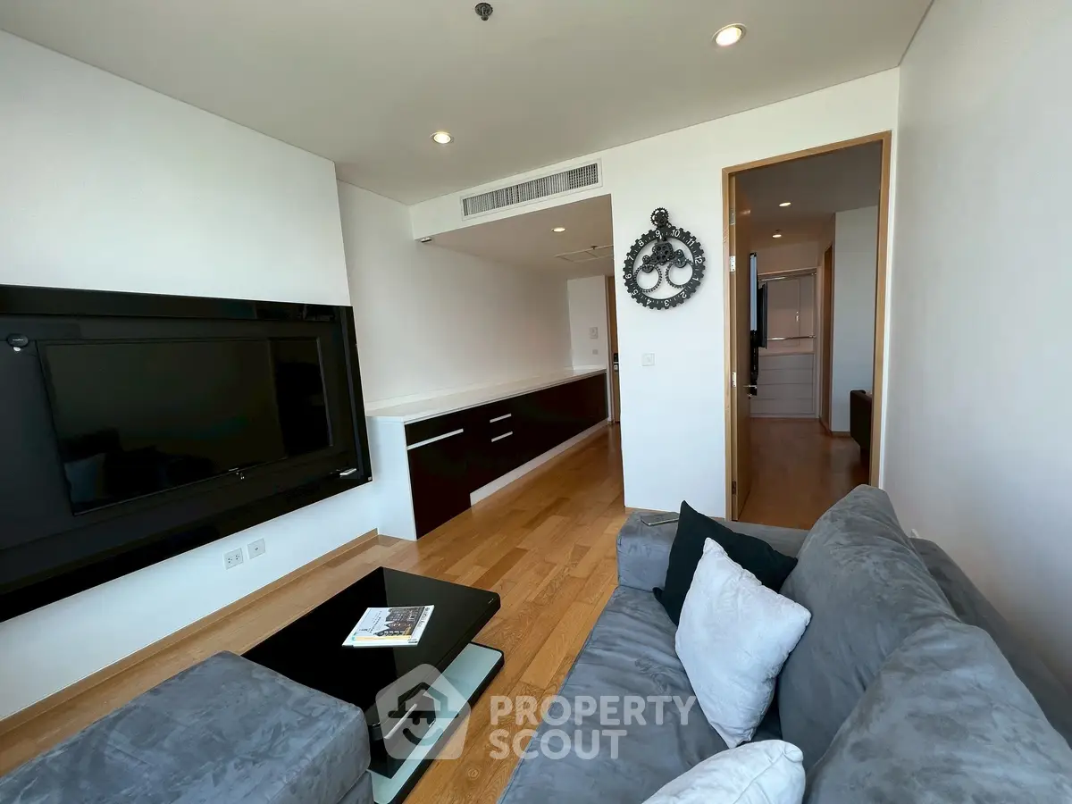 Modern living room with sleek design and cozy seating area