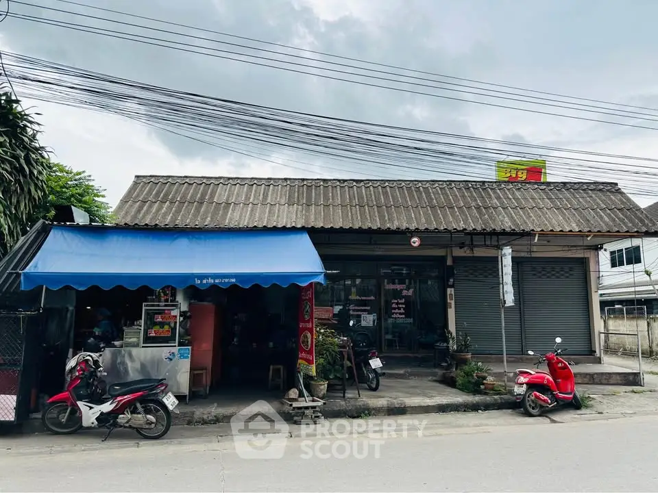 Charming street-front property with retail potential and ample parking space.