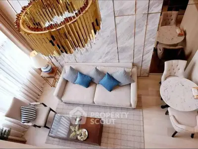Luxurious modern living room with elegant chandelier and stylish decor