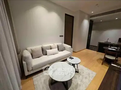 Modern living room with cozy sofa and stylish marble coffee tables in a contemporary apartment.