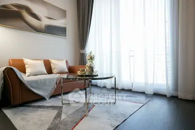 Elegant living room with modern decor and large window, featuring a stylish sofa and chic coffee table.