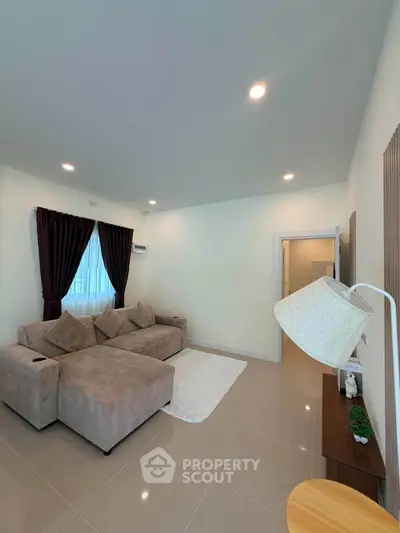 Spacious living room with modern decor and cozy seating area
