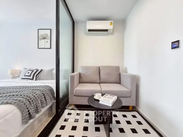 Modern small living area with cozy sofa and stylish decor