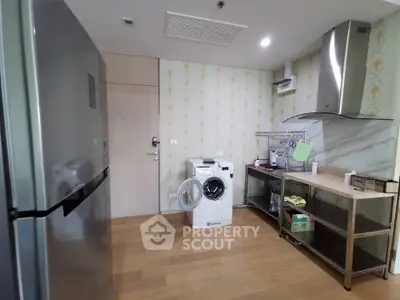 Spacious kitchen with modern appliances and open layout in a stylish apartment.