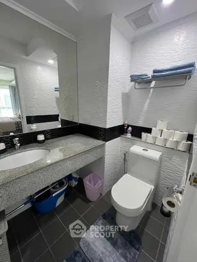 Modern bathroom with sleek design and ample storage space