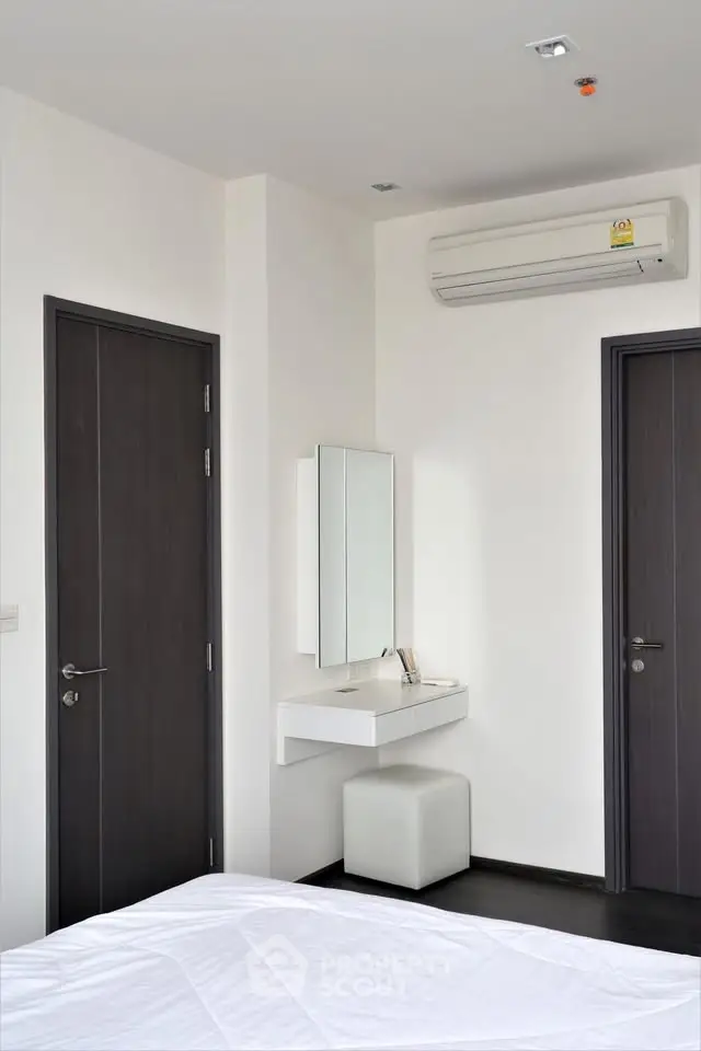 Modern bedroom with sleek design and air conditioning unit