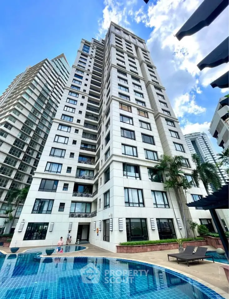 Luxurious high-rise condominium with pool and stunning architecture in prime urban location.