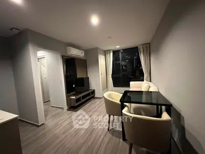 Modern living room with sleek furniture and city view, perfect for urban living.