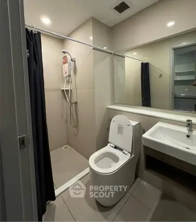 Modern bathroom with sleek fixtures and spacious shower area