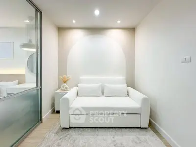 Modern minimalist living room with white sofa and soft lighting