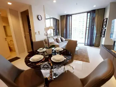 Modern living room with dining area and large windows in a stylish apartment.