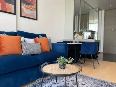 Stylish modern living room with blue sofa and chic decor