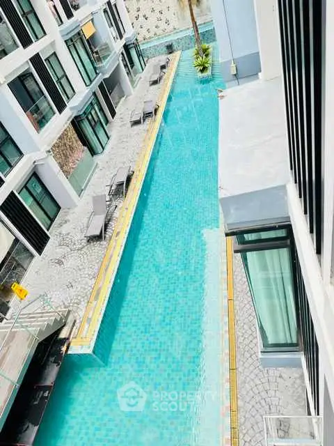 Luxurious apartment complex with a stunning swimming pool view.