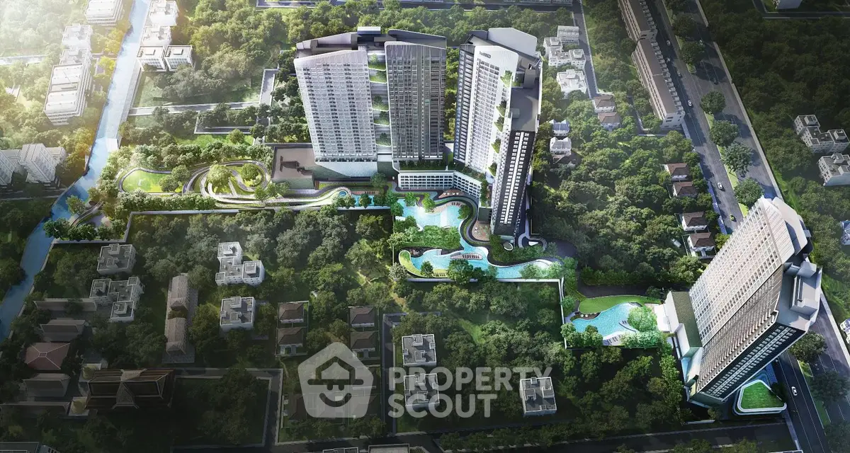 Stunning aerial view of modern high-rise residential complex with lush greenery and pools.