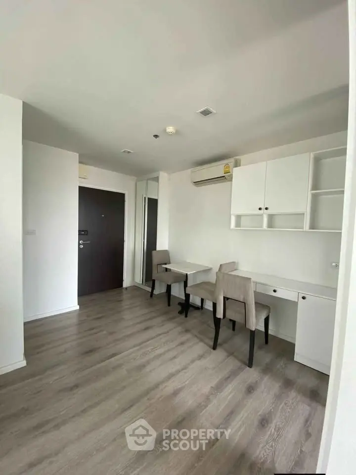 Modern apartment interior with sleek flooring and minimalist furniture