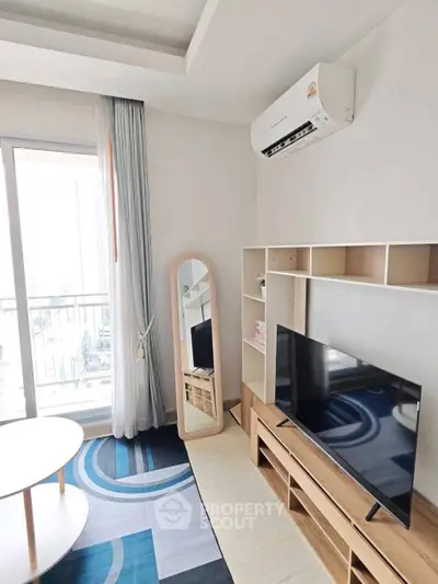 Modern living room with stylish decor and balcony view