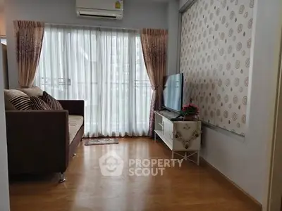 Cozy living room with large window and modern decor