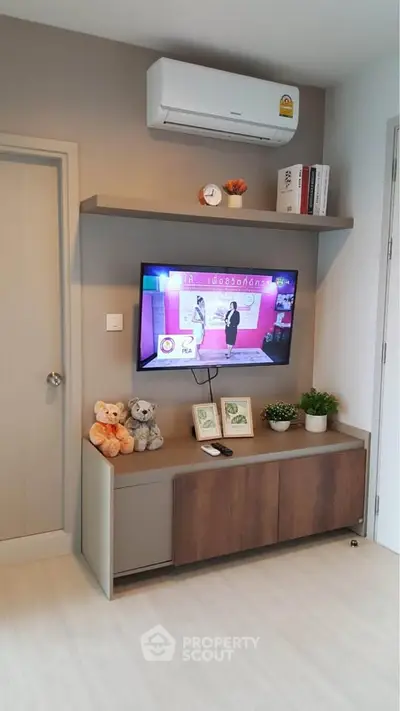Modern living room with wall-mounted TV and stylish decor