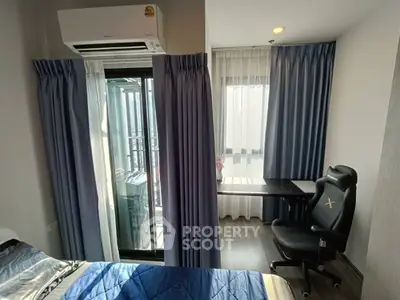 Modern bedroom with balcony access and study area, featuring sleek design and natural light.