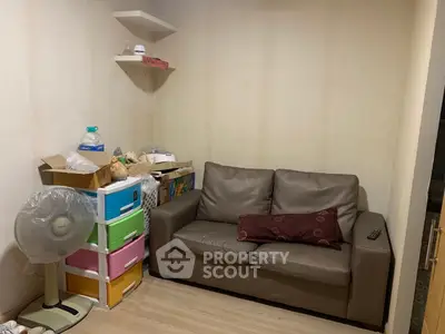 Cozy living room with brown sofa and colorful storage bins, ideal for compact spaces.