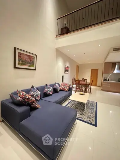 Spacious modern living room with high ceiling and elegant decor