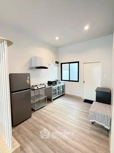 Modern kitchen with sleek appliances and open layout in a stylish home.