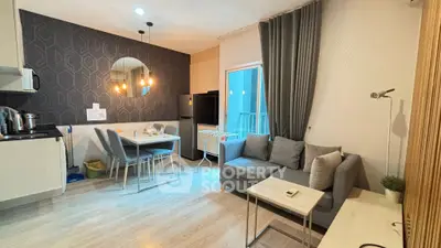 Modern living room with stylish decor and open kitchen layout