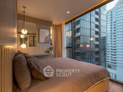 Luxurious bedroom with modern decor and stunning city view from large window.