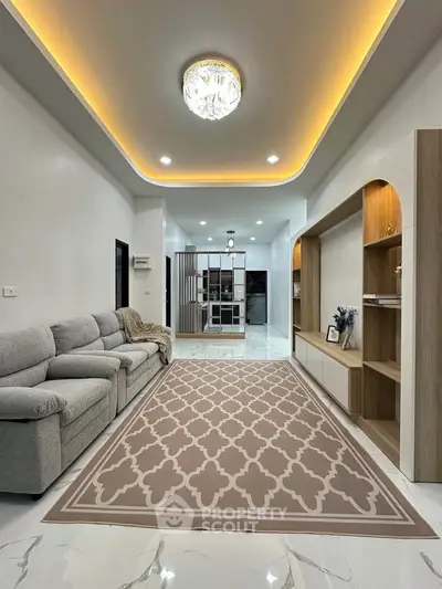 Spacious modern living room with elegant lighting and stylish decor
