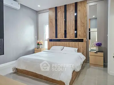 Modern bedroom with stylish wood paneling and elegant decor