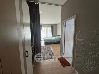 Spacious bedroom with modern decor and natural light