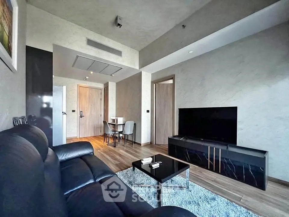 Modern living room with sleek furniture and stylish decor in a contemporary apartment.