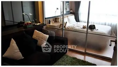 Modern studio apartment with cozy living area and stylish bedroom