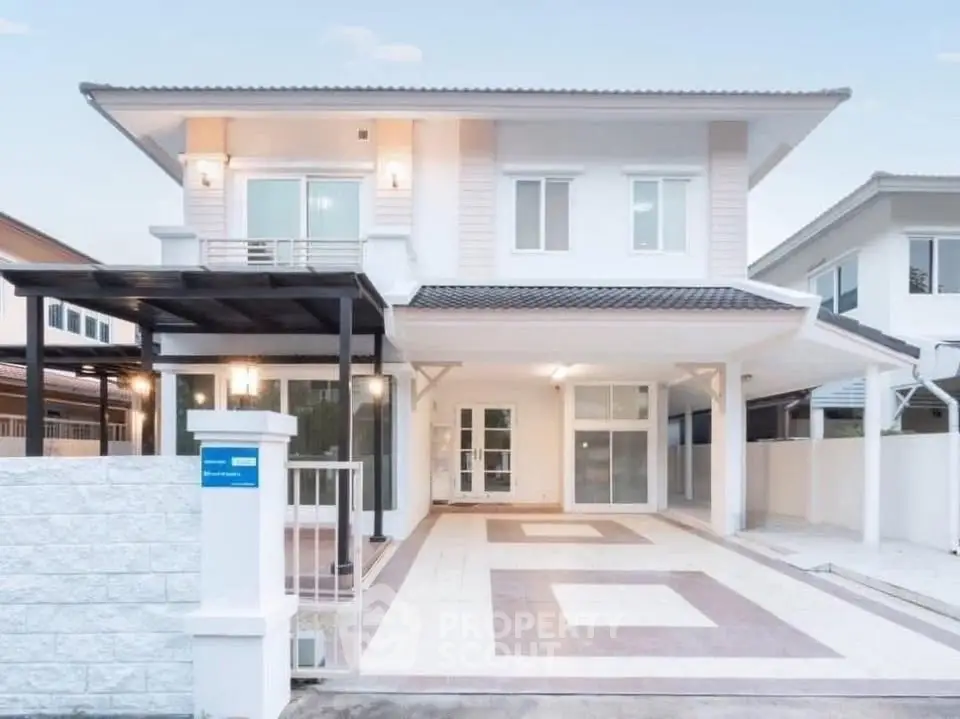 Stunning modern two-story house with spacious driveway and elegant facade.