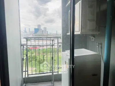 Charming balcony with city view and laundry area in modern apartment.