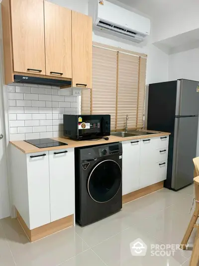 Modern kitchen with sleek appliances and stylish cabinetry