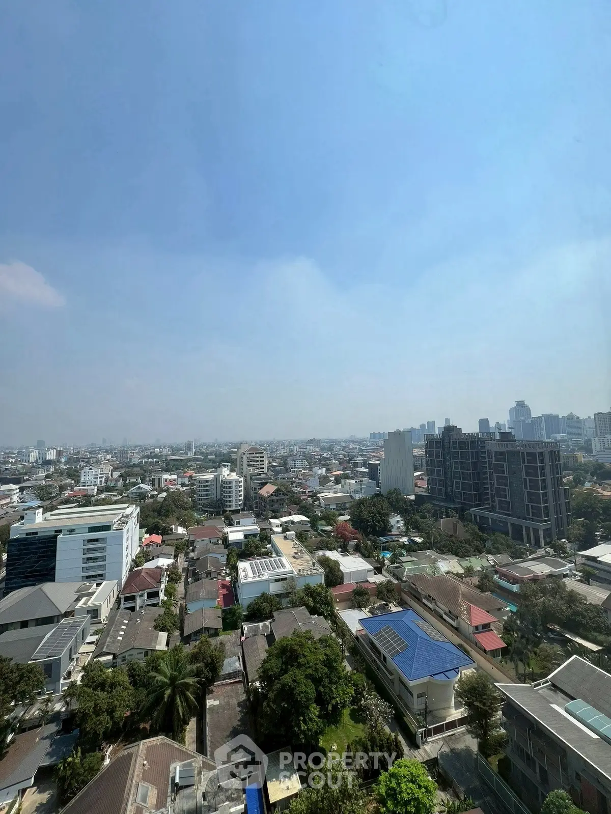 Stunning cityscape view from a high-rise building showcasing urban living and skyline.