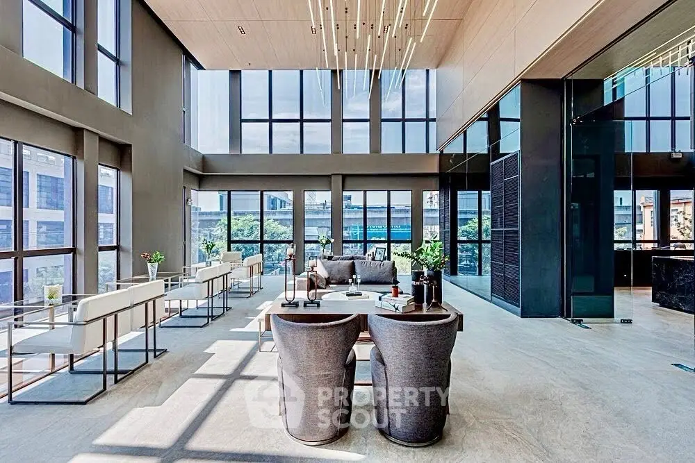Luxurious modern living room with high ceilings and expansive windows offering stunning city views.